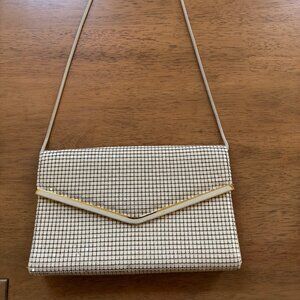 Vintage cream and gold metal mesh convertible clutch purse with a strap.